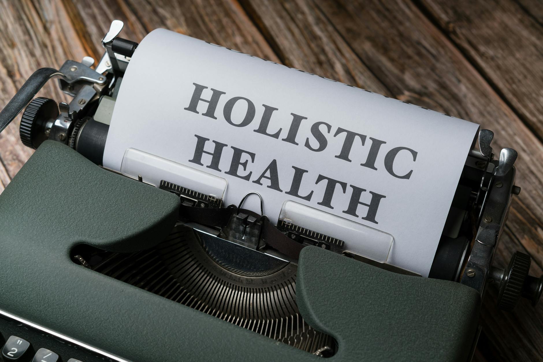 a typewriter with the word holistic health on it